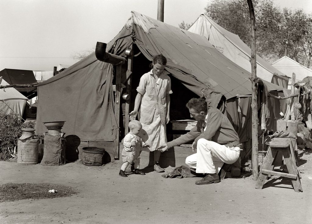 Migrant workers lived in tents in Weedpatch Camp, California. California archive photo