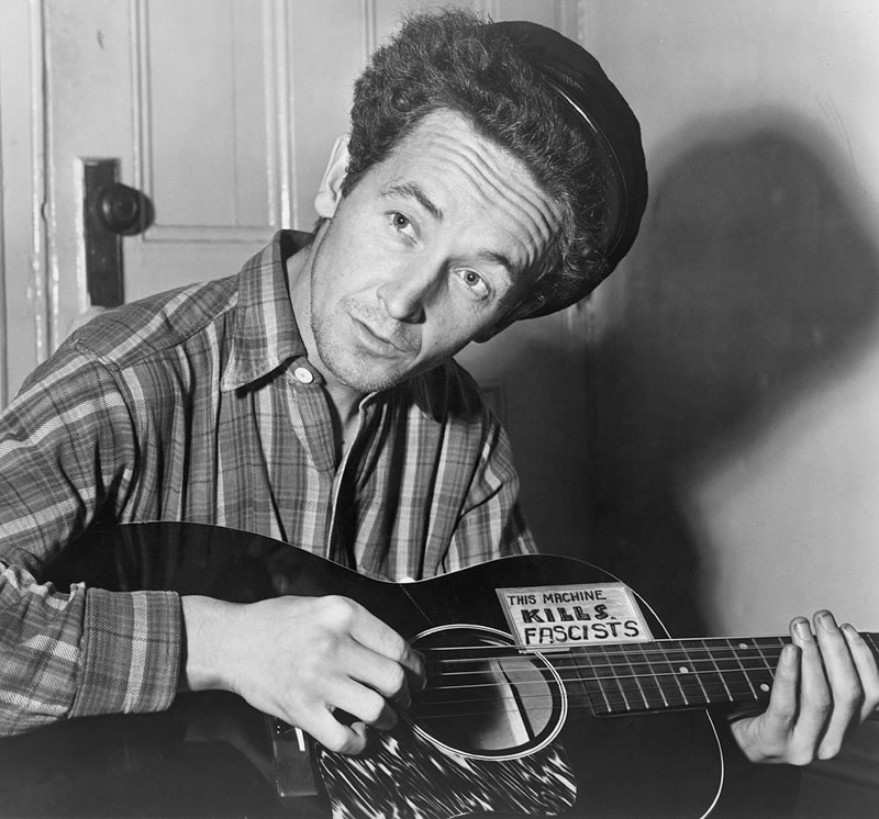 Woody Guthrie. March 1943. Credit: Al Aumuller, The Library of Congress, Prints & Photographs Division